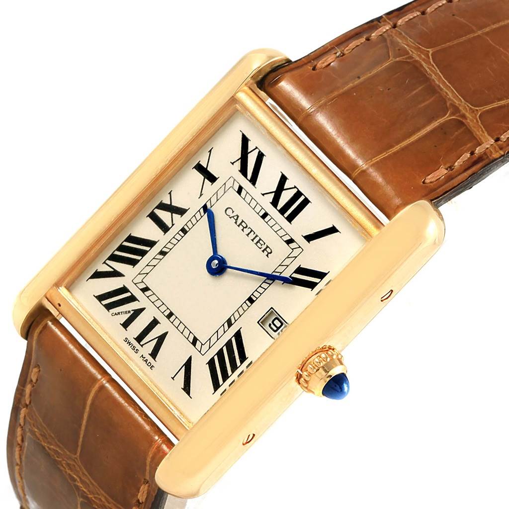 This image shows a close-up of the face and strap of the Cartier Tank Louis W1529756 Yellow Gold Silver Dial W1529756 Yellow Gold Silver Dial watch, highlighting its Roman numerals and blue hands.