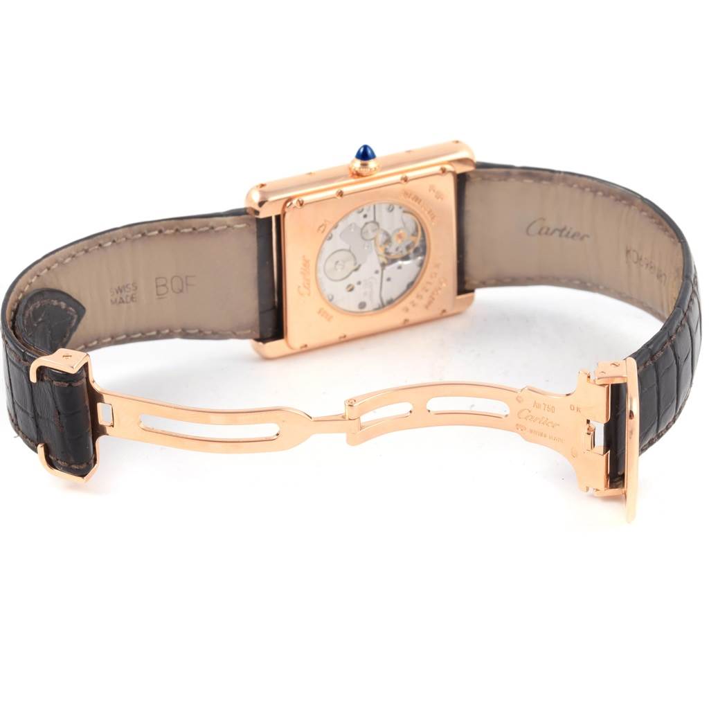 The image shows the back of a Cartier Tank Louis W1560003 Men's Rose Gold Silver Dial W1560003 Men's Rose Gold Silver Dial watch, highlighting its mechanism and deployant clasp.