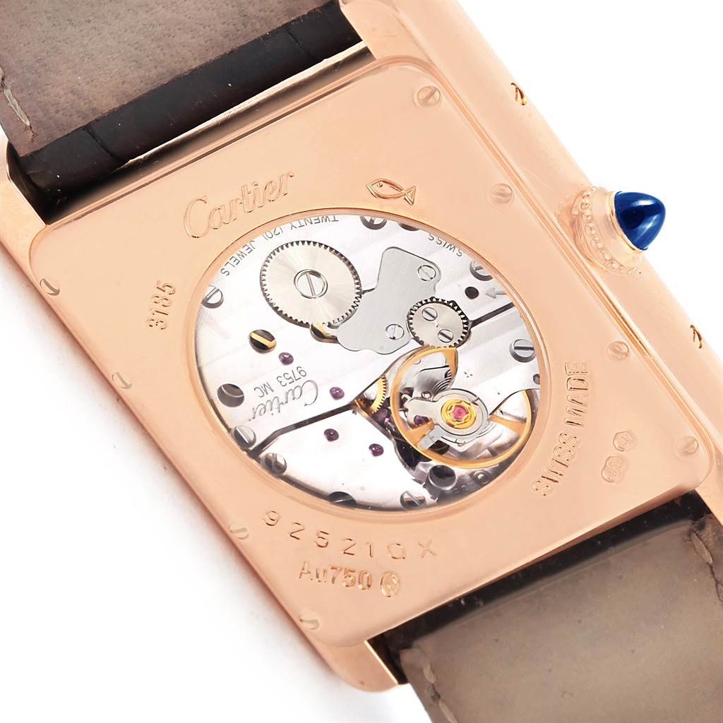 The image shows the back of the Cartier Tank Louis W1560003 Men's Rose Gold Silver Dial W1560003 Men's Rose Gold Silver Dial watch, revealing its internal mechanical components and engravings.