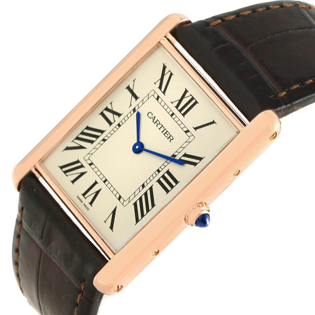 The image shows a Cartier Tank Louis W1560017 Men's Rose Gold Silver Dial W1560017 Men's Rose Gold Silver Dial watch at an angle, highlighting the face, Roman numerals, and leather strap.