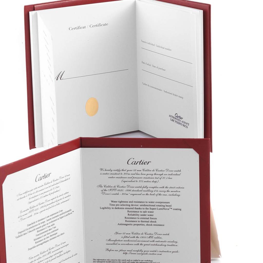 This image shows the certificate and warranty booklet for the Cartier Tank Louis W1560017 Men's Rose Gold Silver Dial W1560017 Men's Rose Gold Silver Dial watch, photographed from an angled top view.