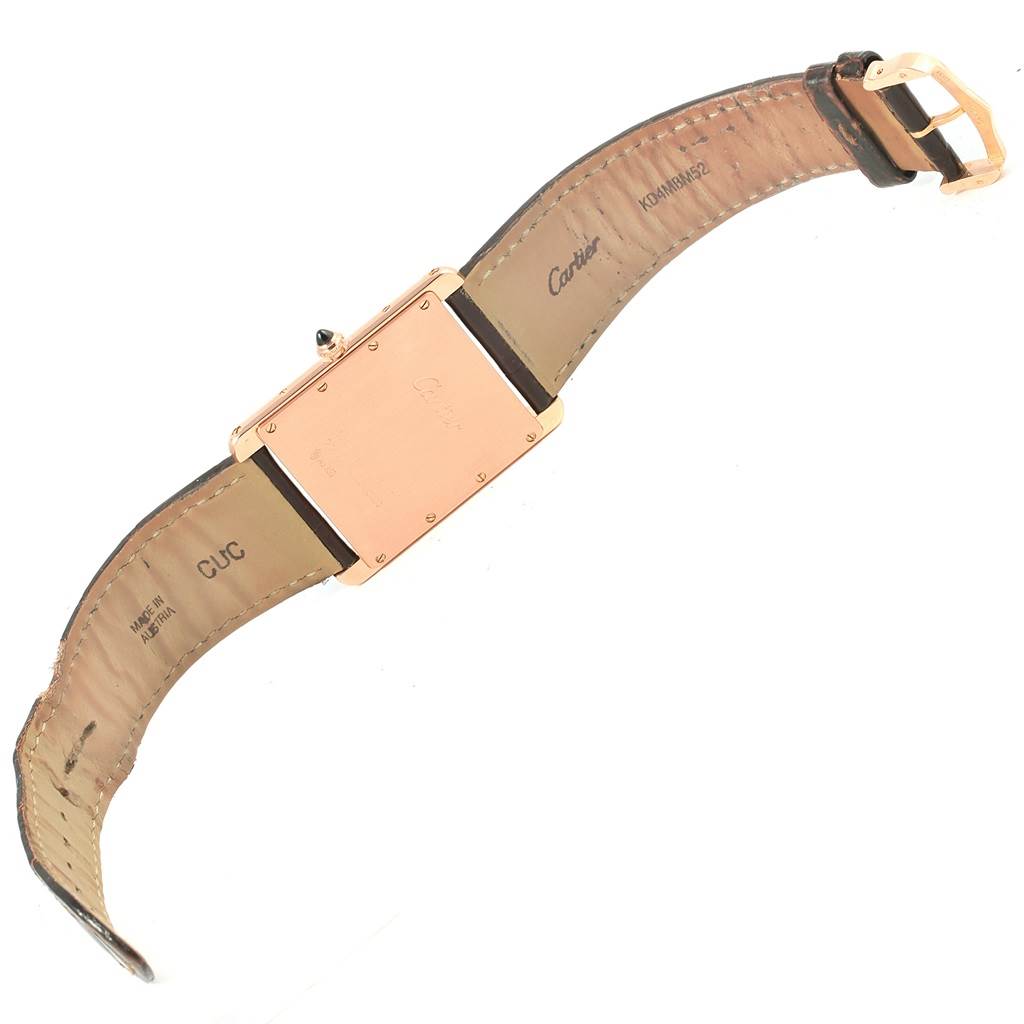 The image shows the back view of a Cartier Tank Louis W1560017 Men's Rose Gold Silver Dial W1560017 Men's Rose Gold Silver Dial watch, highlighting the rose gold case and leather strap.