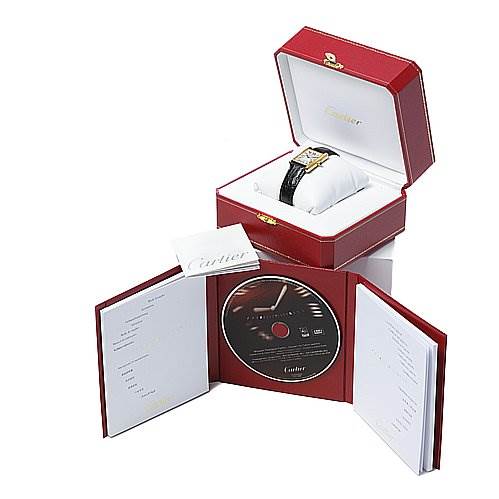 The image shows a Cartier Tank Louis W1529756 Yellow Gold White Dial W1529756 Yellow Gold White Dial watch in its open box with accompanying documents and a CD on display.