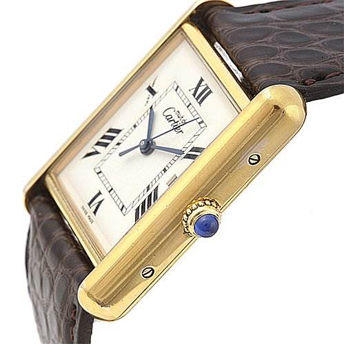 This image showcases the side angle of the Cartier Tank Louis Yellow Gold White Dial Yellow Gold White Dial watch, focusing on its crown and part of its leather strap.