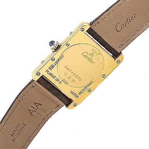The image shows the back of a Cartier Tank Louis Yellow Gold White Dial Yellow Gold White Dial watch, highlighting the case back and leather strap.