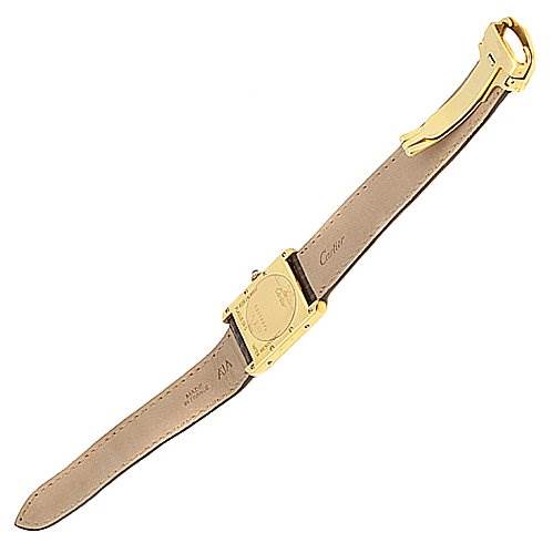 The image shows the back and strap of a Cartier Tank Louis Yellow Gold White Dial Yellow Gold White Dial watch lying flat, showcasing its gold buckle and leather band.