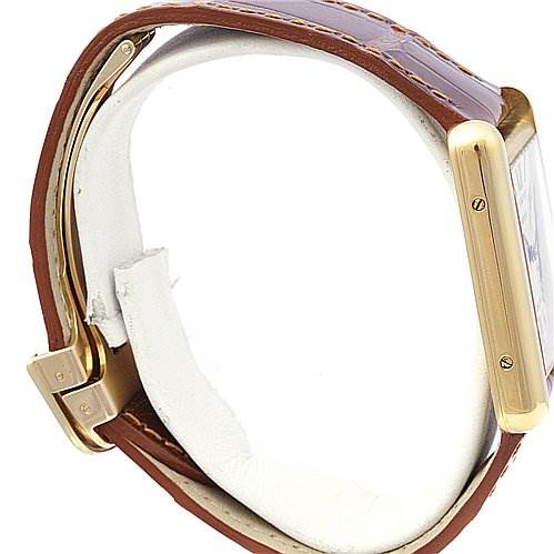 The image shows a side view of the Cartier Tank Louis W1529756 Yellow Gold White Dial W1529756 Yellow Gold White Dial watch, focusing on the gold case and brown leather strap.