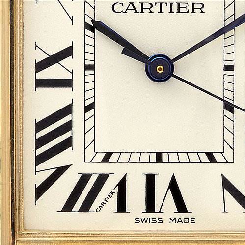 Close-up angle of the Cartier Tank Louis W1529756 Yellow Gold White Dial W1529756 Yellow Gold White Dial watch face, showing Roman numerals and the hands.
