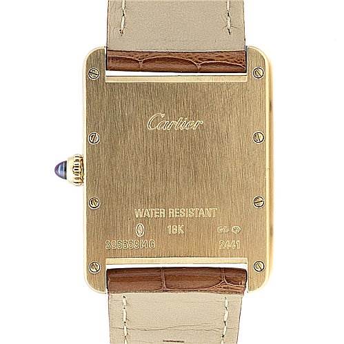 The image shows the back case of the Cartier Tank Louis W1529756 Yellow Gold White Dial W1529756 Yellow Gold White Dial watch, highlighting the case material, model information, and leather straps.