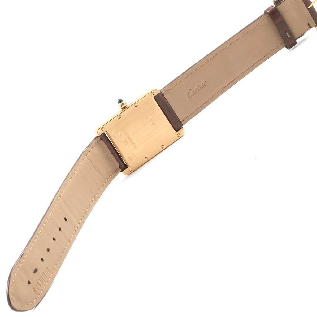 This image shows the back and part of the strap of a Cartier Tank Louis W1529756 Men
s Yellow Gold Silver Dial W1529756 Men
s Yellow Gold Silver Dial watch.