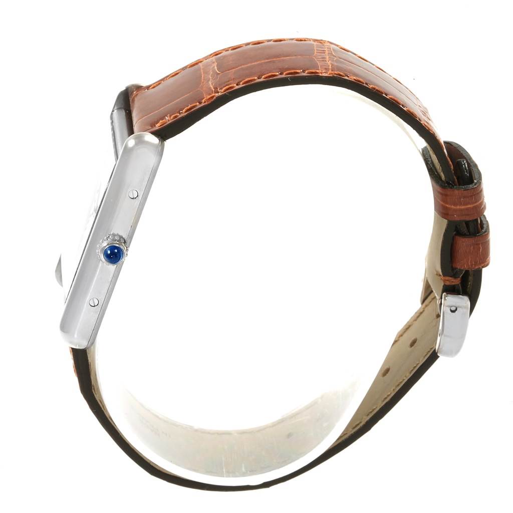 The image shows a side view of the Tank Louis model by Cartier, highlighting the case, crown, and brown leather strap.