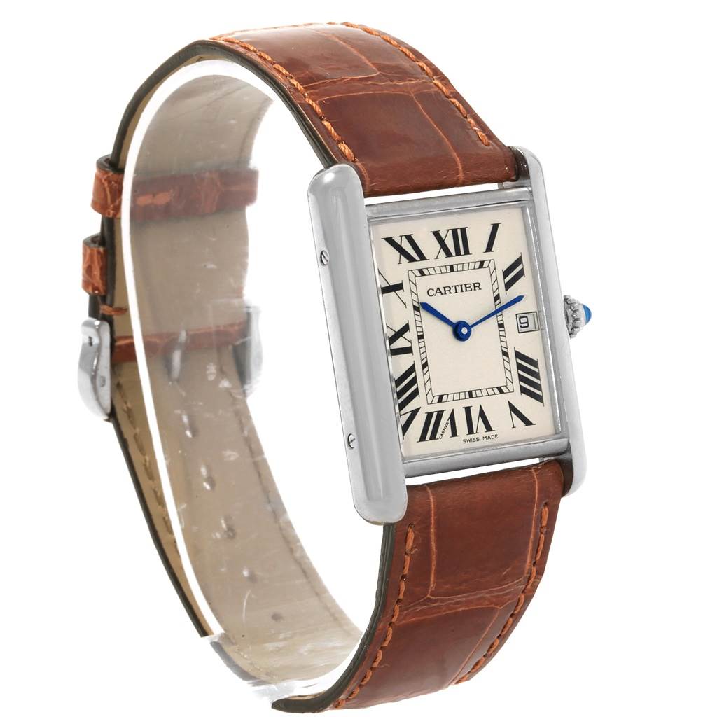 The image shows a Tank Louis watch by Cartier at an angled view, highlighting its rectangular face, Roman numerals, and brown leather strap.