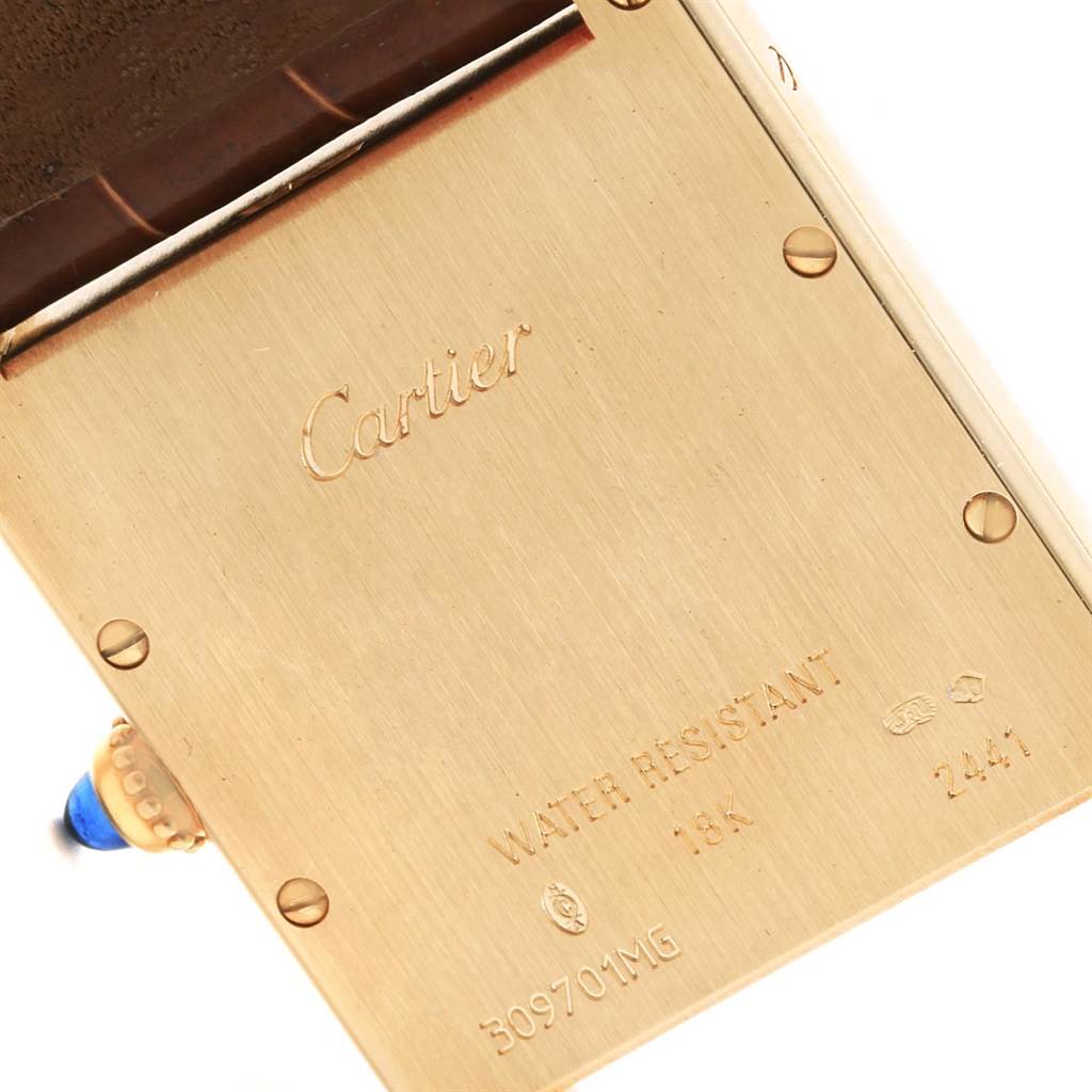 The image shows the back of a Cartier Tank Louis W1529756 Men
s Yellow Gold Silver Dial W1529756 Men
s Yellow Gold Silver Dial watch, revealing its water resistance and 18K gold case.