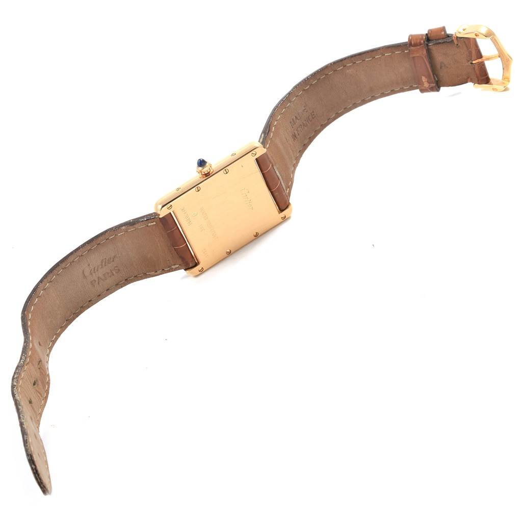 This image shows the back and sides of a Cartier Tank Louis W1529756 Men
s Yellow Gold Silver Dial W1529756 Men
s Yellow Gold Silver Dial watch, including the strap, case, and buckle.