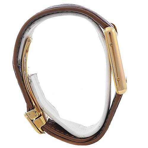 This image shows a side view of the Cartier Tank Louis 2413 137611PL Yellow Gold Beige Dial 2413 137611PL Yellow Gold Beige Dial watch, highlighting its gold case and brown leather strap.