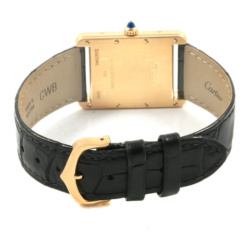 This image shows the back view of the Tank Louis model by Cartier, highlighting the case back, crown, and leather strap.