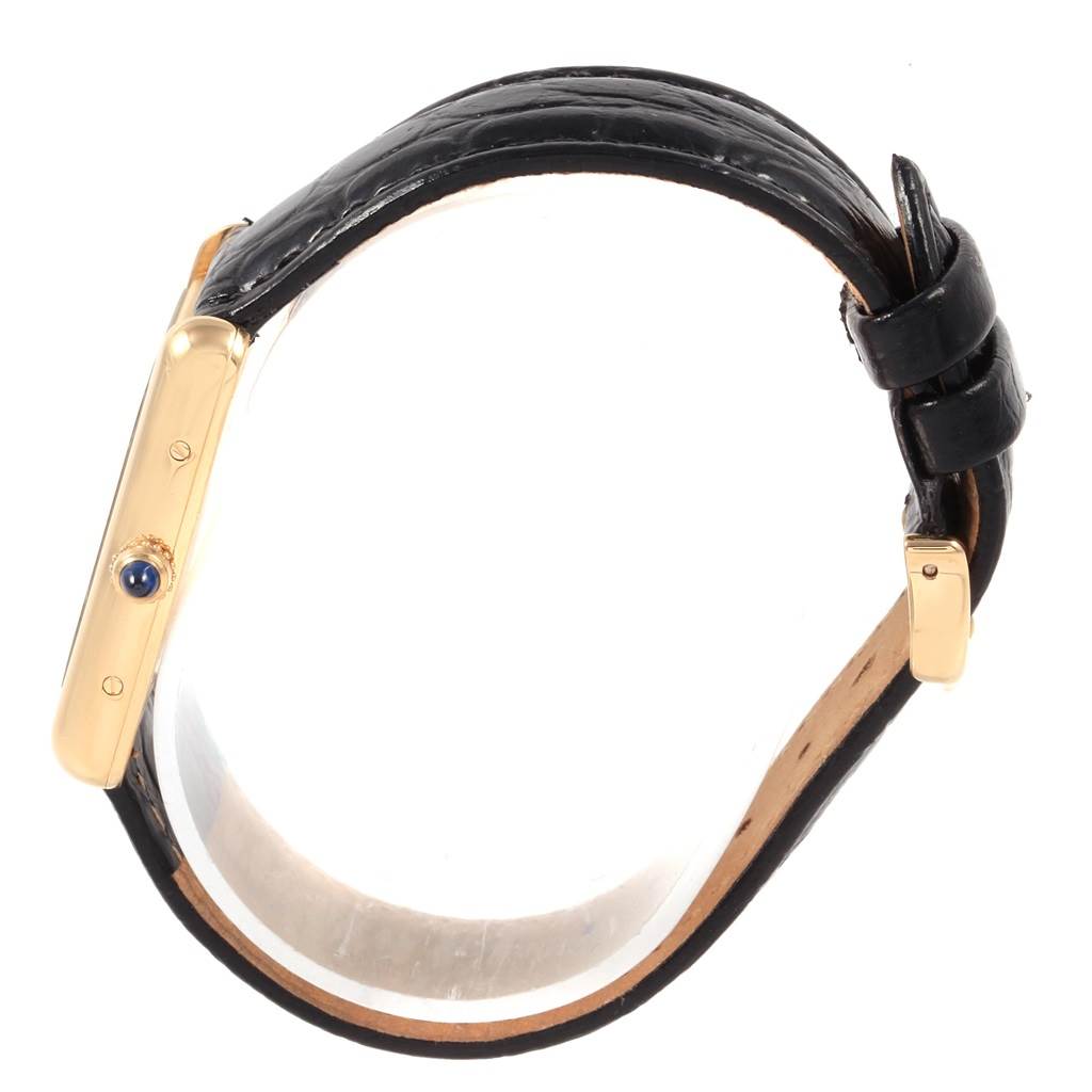 This image shows a side view of the Cartier Tank Louis W1529756 Men's Yellow Gold Silver Dial W1529756 Men's Yellow Gold Silver Dial watch, highlighting its gold case, crown, and leather strap.