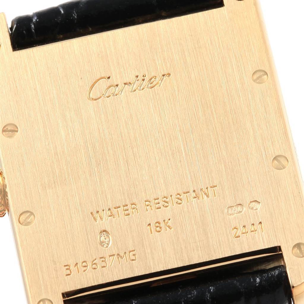 The image shows the back case of a Cartier Tank Louis W1529756 Men's Yellow Gold Silver Dial W1529756 Men's Yellow Gold Silver Dial watch model, displaying engraving details and part of the leather strap.