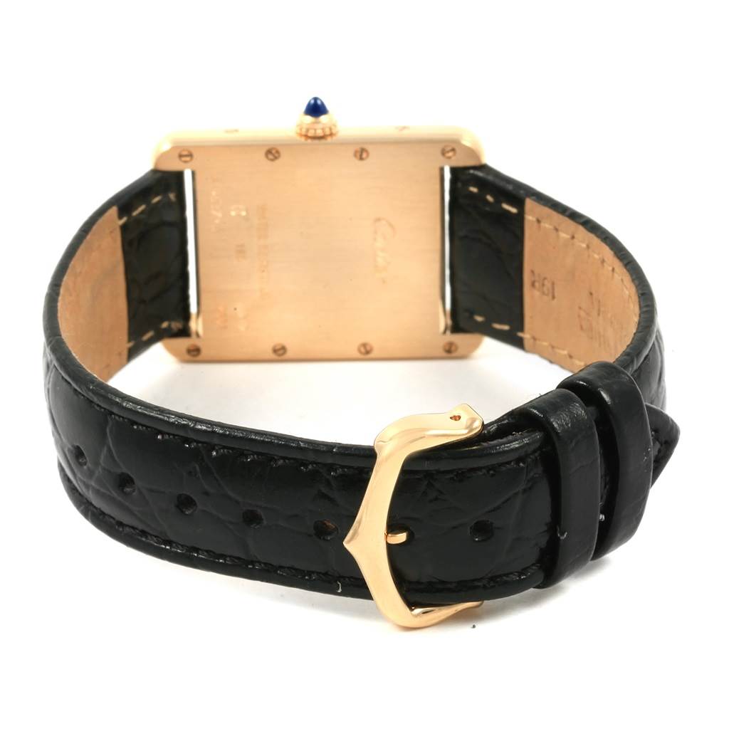 The image shows the back view of a Cartier Tank Louis W1529756 Men's Yellow Gold Silver Dial W1529756 Men's Yellow Gold Silver Dial watch, highlighting the gold case, crown, and black leather strap with a buckle.