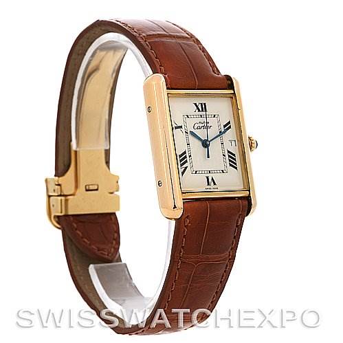 The image shows a Cartier Tank Louis Yellow Gold Beige Dial Yellow Gold Beige Dial watch at a front-left angle, highlighting the face, strap, and clasp.