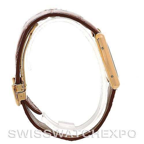 This image shows a side view of the Cartier Tank Louis Yellow Gold Beige Dial Yellow Gold Beige Dial model watch, featuring the strap and case.