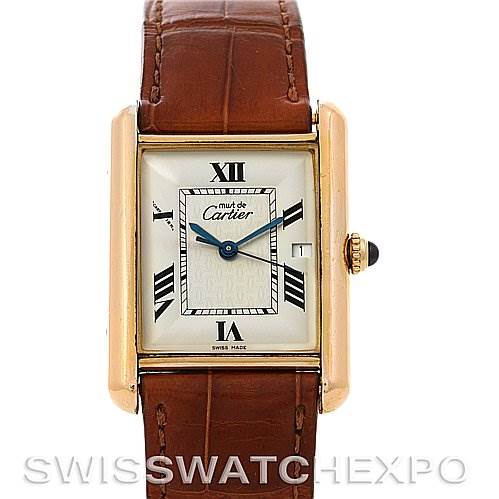 This image shows a front view of a Cartier Tank Louis Yellow Gold Beige Dial Yellow Gold Beige Dial watch with a brown leather strap and a white dial.