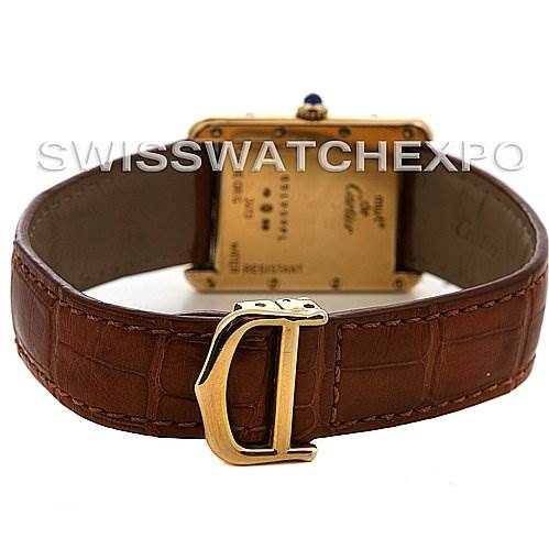 The image shows a Cartier Tank Louis Yellow Gold Beige Dial Yellow Gold Beige Dial watch's back, highlighting its brown leather strap and gold clasp from a rear angle.