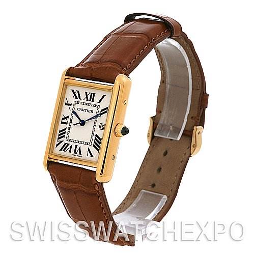 The image shows an angled view of a Cartier Tank Louis W1529756 Yellow Gold White Dial W1529756 Yellow Gold White Dial model watch, highlighting its rectangular dial, leather strap, and gold casing.