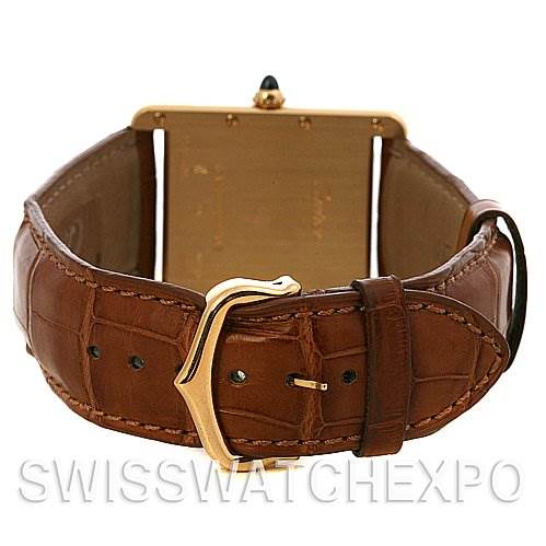 The image shows the back view of a Tank Louis Cartier watch highlighting the leather strap and buckle.