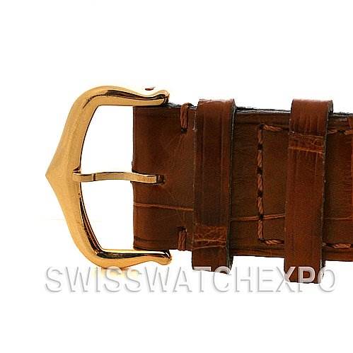 The image shows a close-up of the gold buckle and brown leather strap of a Cartier Tank Louis W1529756 Yellow Gold White Dial W1529756 Yellow Gold White Dial watch.