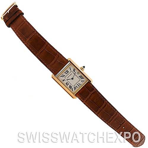 This is a top view of the Cartier Tank Louis W1529756 Yellow Gold White Dial W1529756 Yellow Gold White Dial watch, showing the dial, case, and brown leather strap.