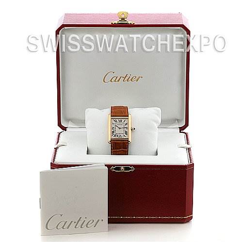 This image shows the Cartier Tank Louis W1529756 Yellow Gold White Dial W1529756 Yellow Gold White Dial watch frontal view, in its case with a manual visible at the front.