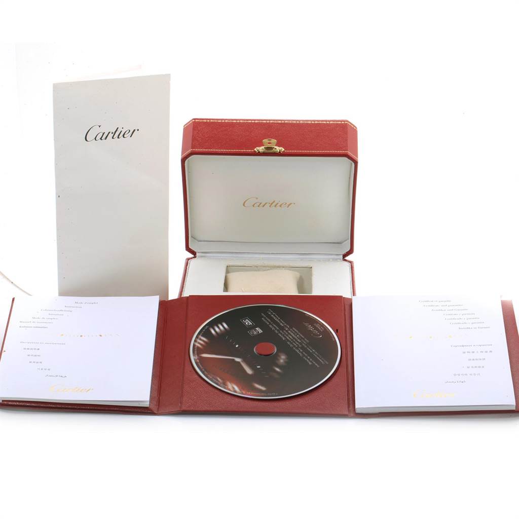 The image shows the packaging, a case, manuals, and a CD for the Cartier Tank Louis W1529756 Men's Yellow Gold Silver Dial W1529756 Men's Yellow Gold Silver Dial watch model.