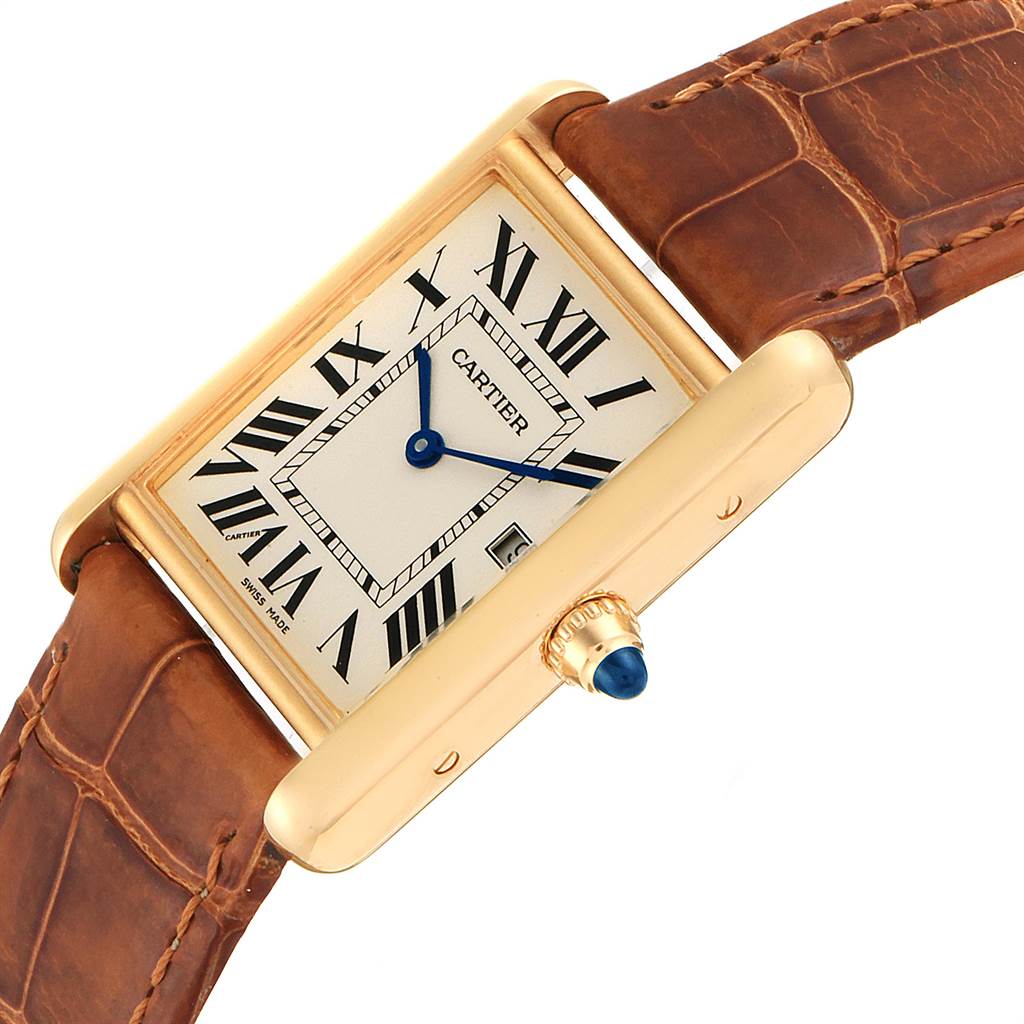 The image shows an angled view of the Cartier Tank Louis W1529756 Men's Yellow Gold Silver Dial W1529756 Men's Yellow Gold Silver Dial watch, highlighting its face, Roman numerals, blue hands, and brown leather strap.