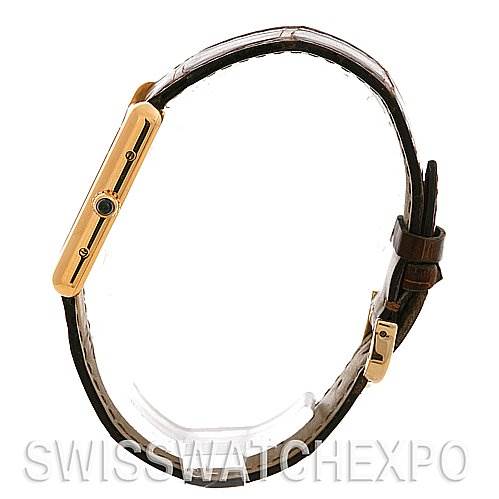 This image shows a side profile of a Cartier Tank Louis W1529756 Yellow Gold White Dial W1529756 Yellow Gold White Dial watch, highlighting its thin case and leather strap.