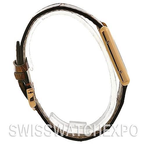 The image shows a side view of the Cartier Tank Louis W1529756 Yellow Gold White Dial W1529756 Yellow Gold White Dial watch, highlighting its gold case and leather strap.