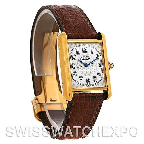This image shows the Tank Louis model by Cartier at a three-quarter angle, highlighting the face, strap, and crown. 