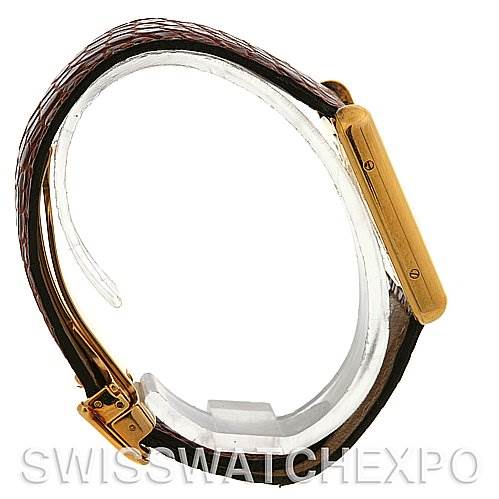 The image shows a side profile of a Cartier Tank Louis Yellow Gold White Dial Yellow Gold White Dial watch, highlighting the strap, case, and buckle.