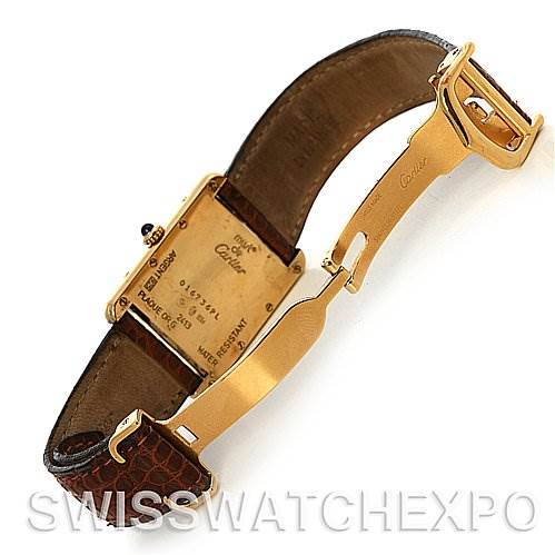 The image shows the back and inner strap of a Tank Louis model watch by Cartier, featuring its clasp and case back.