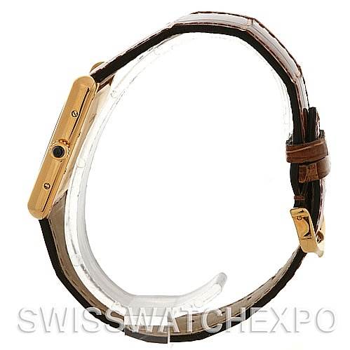 This image shows a side view of the Cartier Tank Louis W1529756 Yellow Gold White Dial W1529756 Yellow Gold White Dial watch, highlighting the case, crown, and leather strap.