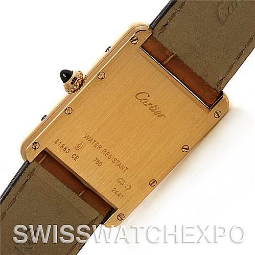 The image shows the back case and leather strap of a Cartier Tank Louis W1529756 Yellow Gold White Dial W1529756 Yellow Gold White Dial watch.