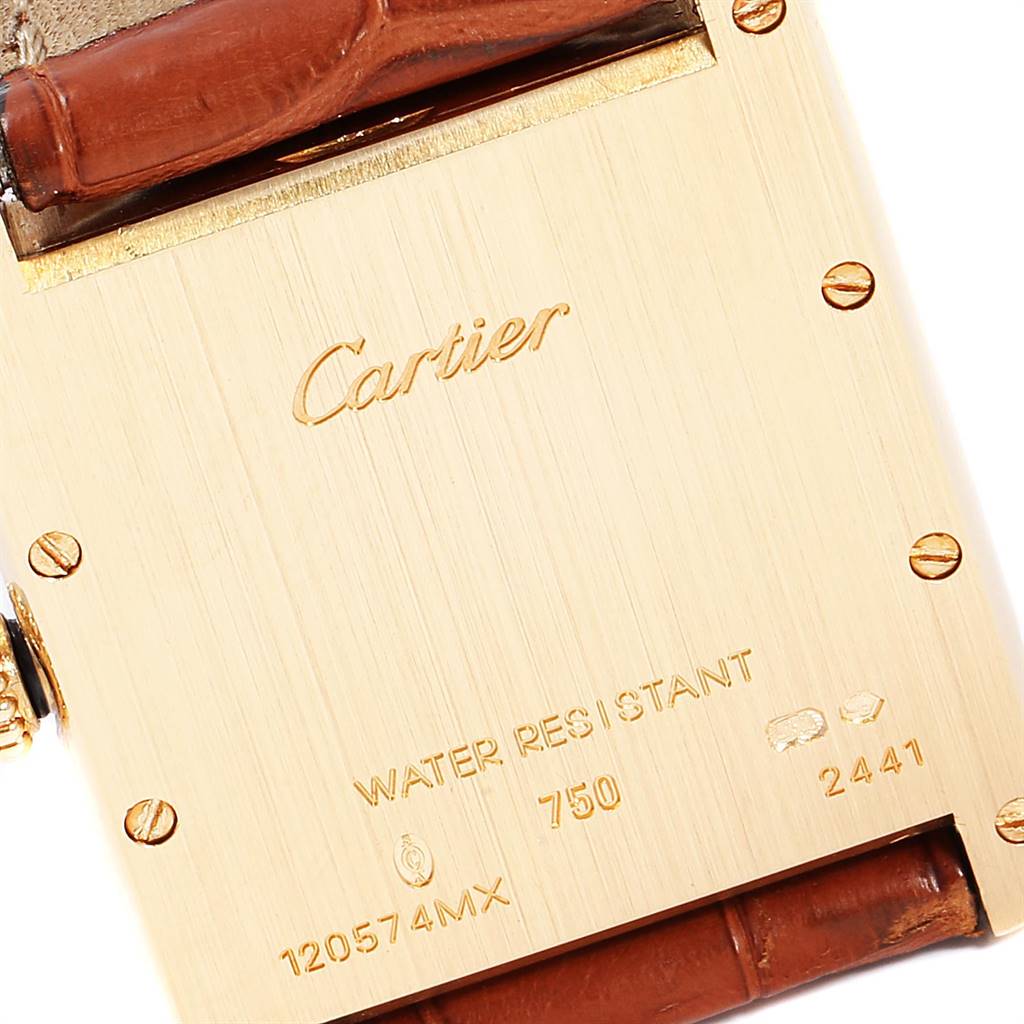 This image shows the backside of a Cartier Tank Louis W1529756 Men's Yellow Gold Silver Dial W1529756 Men's Yellow Gold Silver Dial watch, including the engraved details and part of the leather strap.