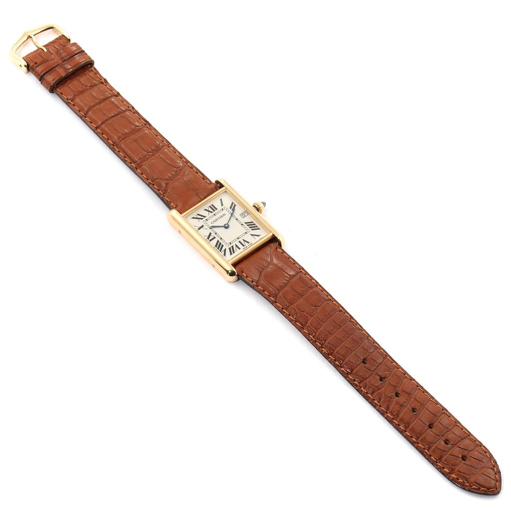 The image shows a Cartier Tank Louis W1529756 Men's Yellow Gold Silver Dial W1529756 Men's Yellow Gold Silver Dial model watch laid flat, displaying its brown leather strap and rectangular gold case.