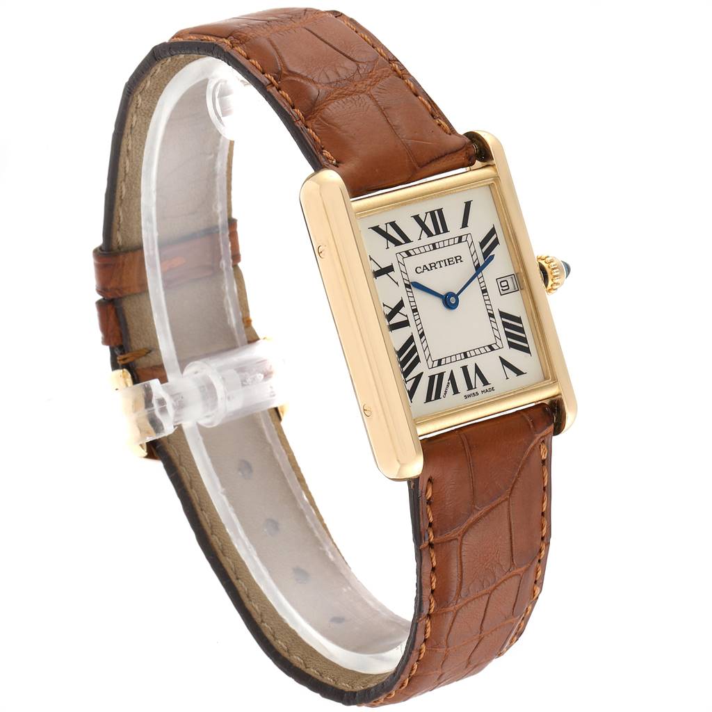 This image shows a Tank Louis model by Cartier at a slight angle, highlighting its face, brown leather strap, and gold casing.