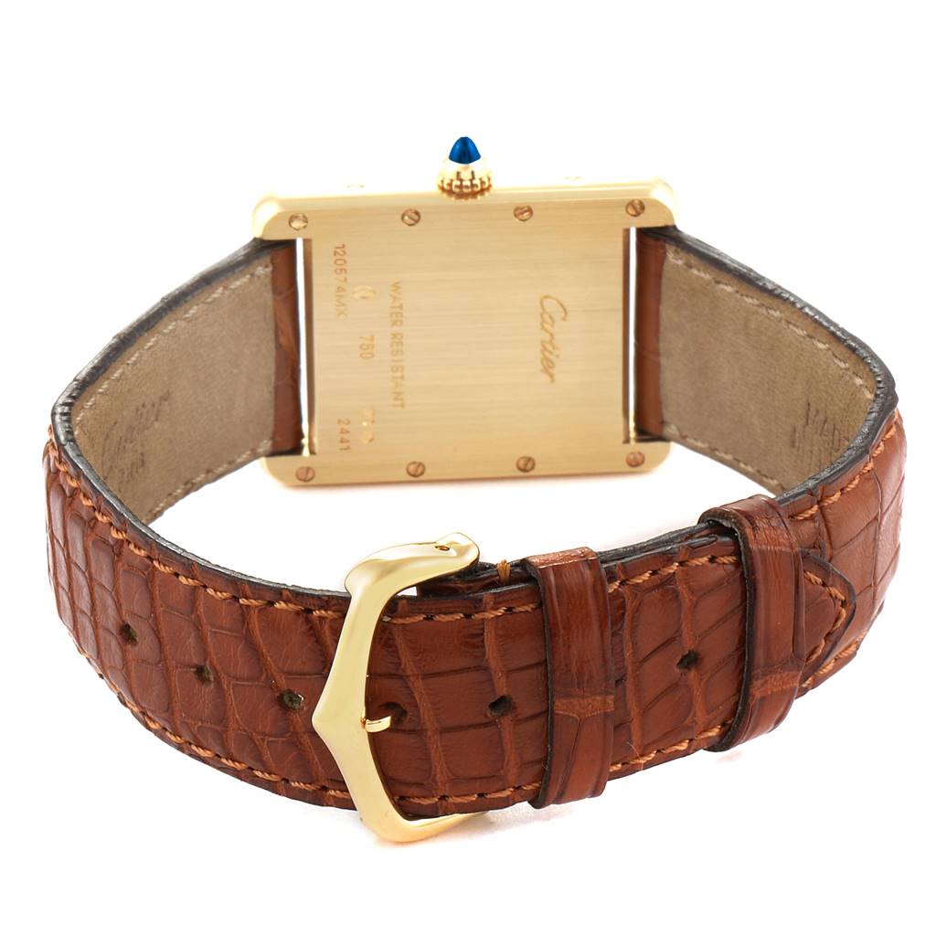 This image shows the back and strap of a Cartier Tank Louis W1529756 Men's Yellow Gold Silver Dial W1529756 Men's Yellow Gold Silver Dial watch, highlighting its gold case and brown leather band.
