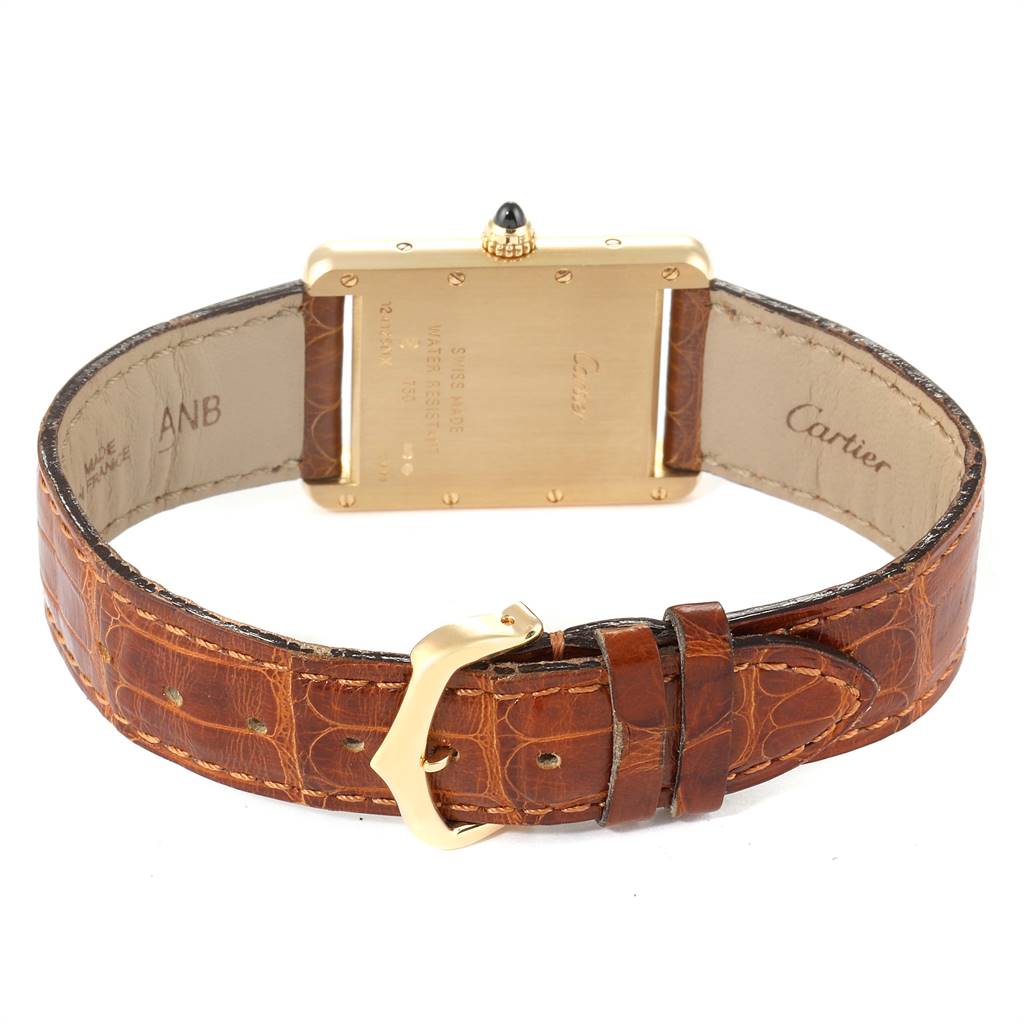 This image shows the back view of a Cartier Tank Louis W1529756 Men
s Yellow Gold Silver Dial W1529756 Men
s Yellow Gold Silver Dial model watch, highlighting its case back, crown, and leather strap with buckle.