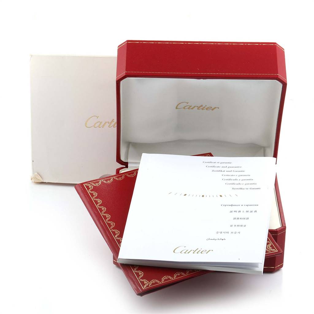 The image shows a Cartier Tank Louis W1529756 Men
s Yellow Gold Silver Dial W1529756 Men
s Yellow Gold Silver Dial watch box, paperwork, and manuals from an angled view.