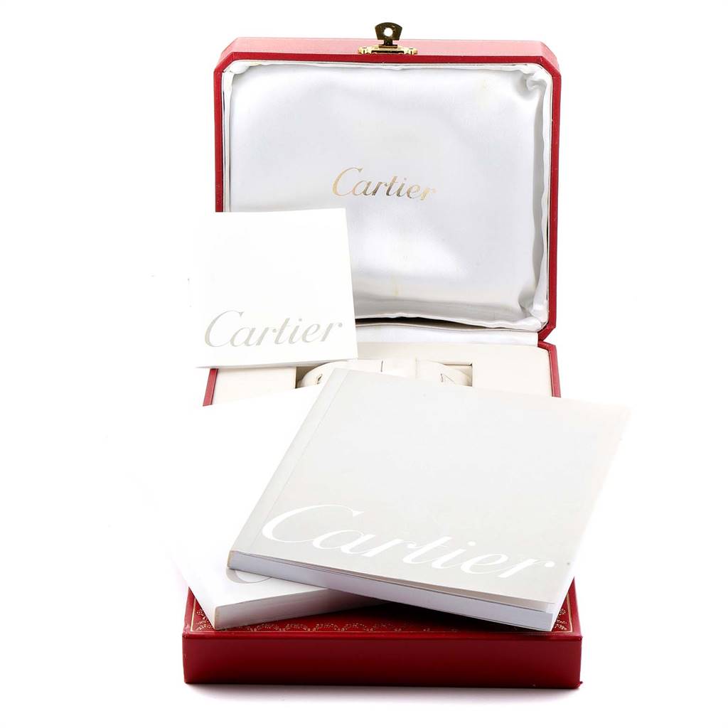 This image shows the packaging and booklets for the Cartier Tank Louis W1529756 Men
s Yellow Gold Silver Dial W1529756 Men
s Yellow Gold Silver Dial watch model.