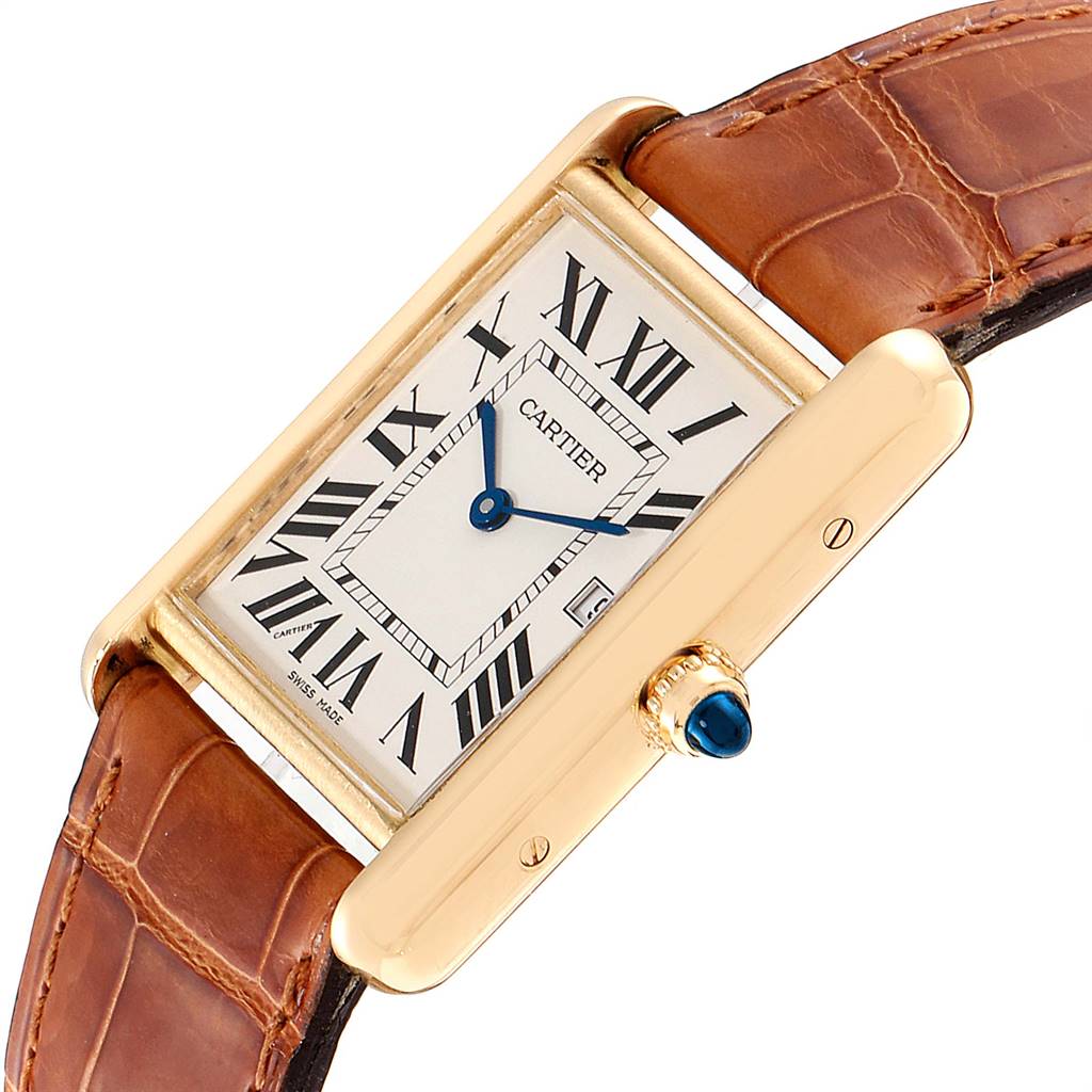 This image shows a close-up of a Cartier Tank Louis W1529756 Men
s Yellow Gold Silver Dial W1529756 Men
s Yellow Gold Silver Dial watch at an oblique angle, highlighting its rectangular face, Roman numerals, and leather strap.