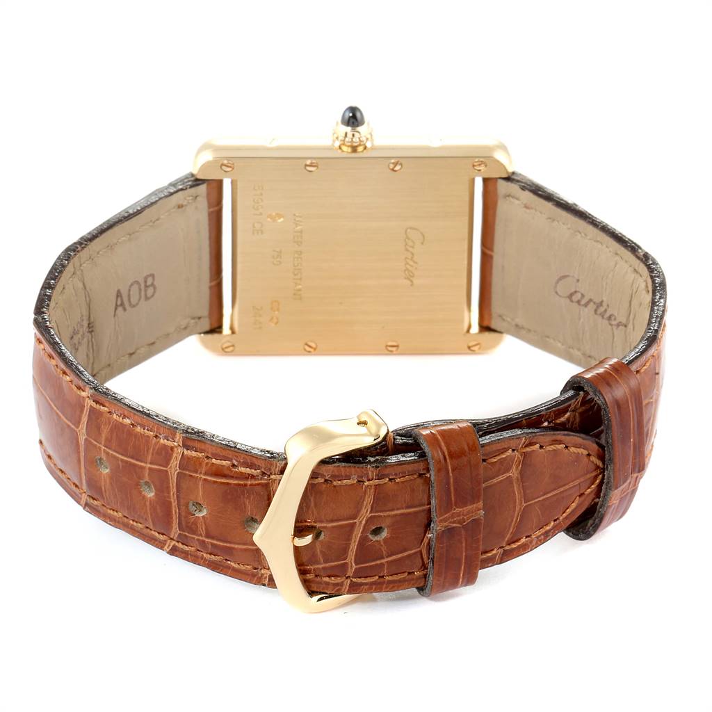 This image shows the back view of a Cartier Tank Louis W1529756 Men
s Yellow Gold Silver Dial W1529756 Men
s Yellow Gold Silver Dial watch, highlighting the leather strap and clasp.